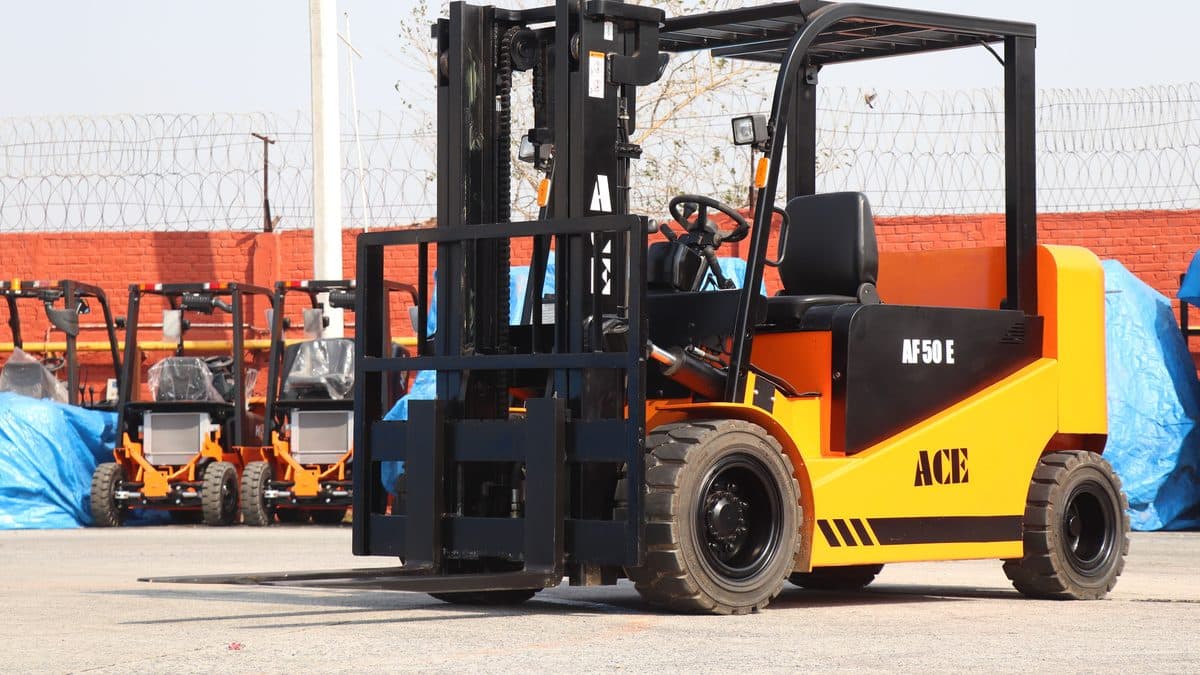A diesel forklift truck parked in an equipment yard